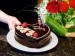 3456240-birthday-cake-and-roses-female-hands-holding-chocolate-heart-cake-and-roses